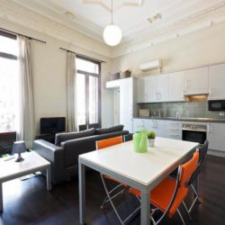 Dining space and kitchen in the background