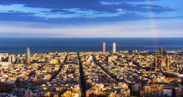 rainbow and barcelona skyline