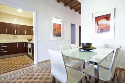 kitchen and table fancy apartment with terrace Barcelona